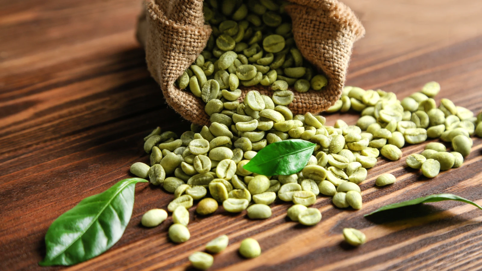 Green Coffee Beans in Sackloth on the Table